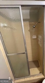 bathroom featuring an enclosed shower