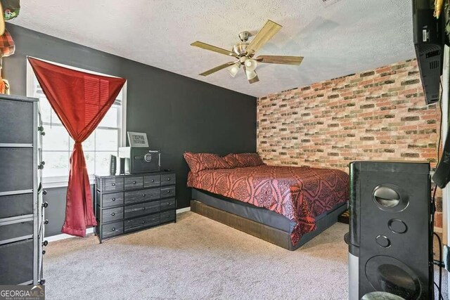 bedroom with light carpet, a textured ceiling, and ceiling fan