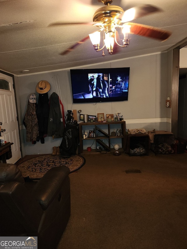 home theater room with carpet flooring, a textured ceiling, and ceiling fan