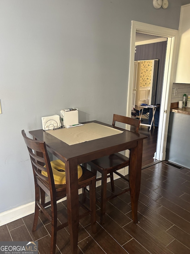 dining area featuring dark hardwood / wood-style floors