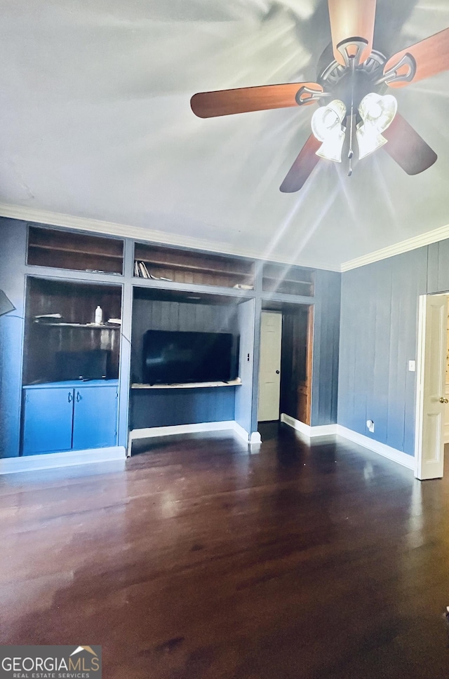 unfurnished living room featuring ornamental molding, dark wood-type flooring, and ceiling fan