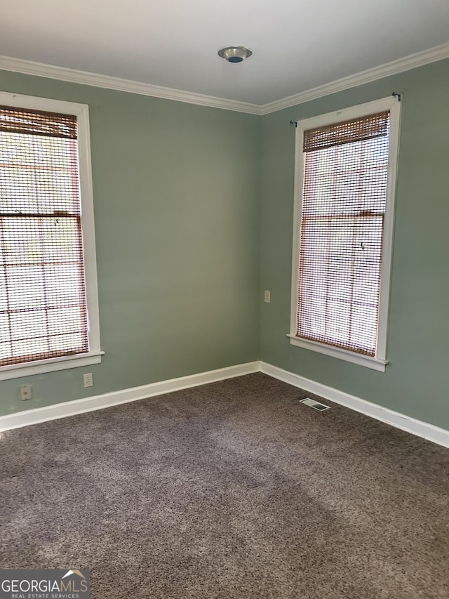 carpeted spare room with ornamental molding