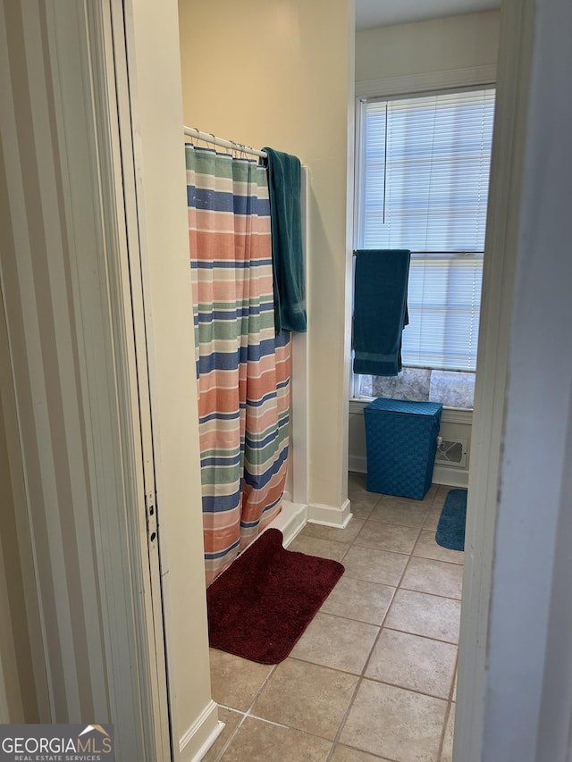 bathroom featuring tile patterned floors and a shower with shower curtain