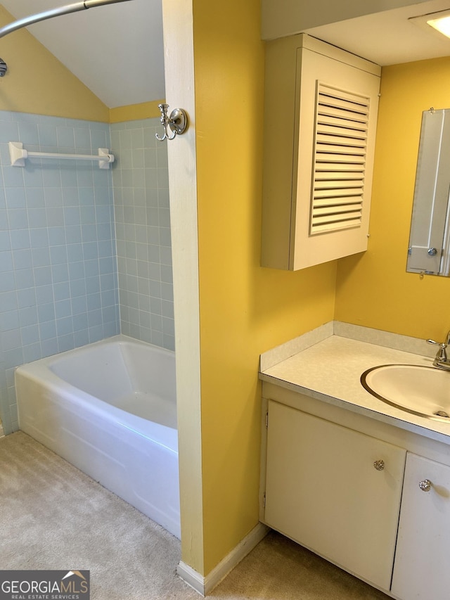 bathroom featuring vanity and tiled shower / bath combo