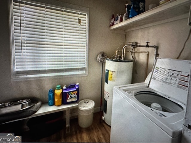 laundry area featuring washer / dryer, water heater, and hardwood / wood-style floors