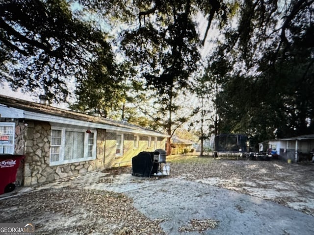 view of yard with a trampoline