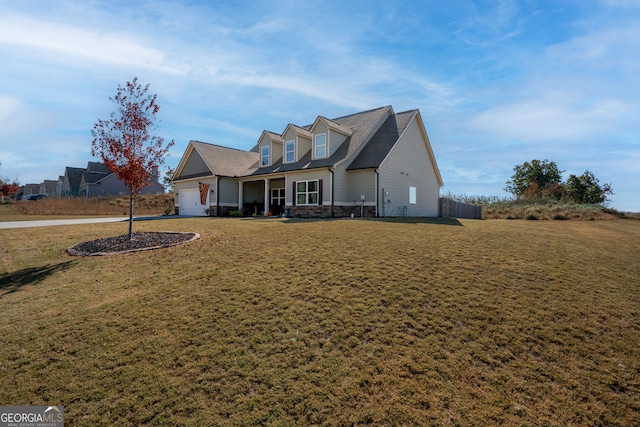 cape cod home featuring a front lawn and a garage