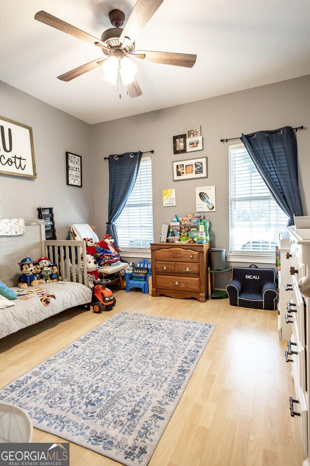 1410 Will Cox Rd, Waycross, GA 31503 - bedroom featuring a ceiling fan and wood finished floors