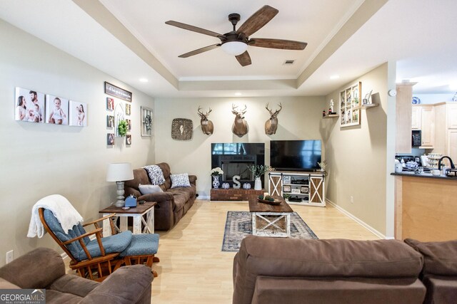 1410 Will Cox Rd, Waycross, GA 31503 - living room with ceiling fan, light wood-style flooring, recessed lighting, a tray ceiling, and visible vents
