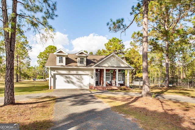 1410 Will Cox Rd, Waycross, GA 31503 - view of front of house with fence, a shingled roof, an attached garage, a porch, and driveway