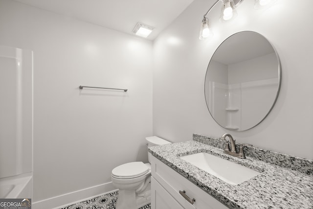 bathroom featuring vanity and toilet