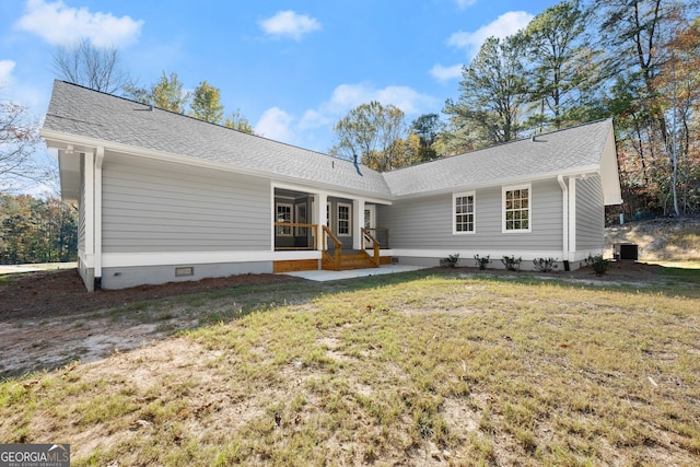 view of front of house featuring a front yard and cooling unit