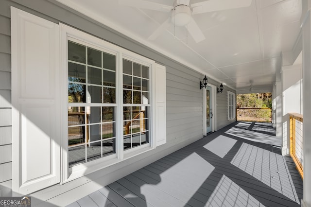 wooden deck with ceiling fan