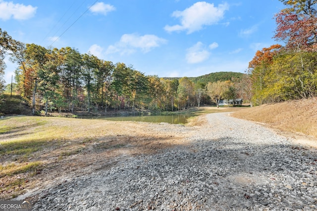 view of road featuring a water view