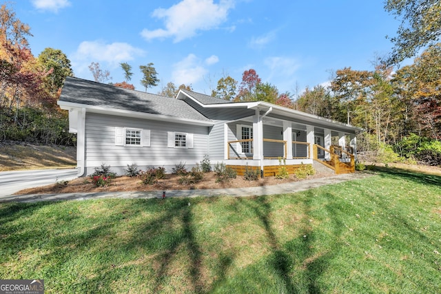 ranch-style home with a front yard and a porch