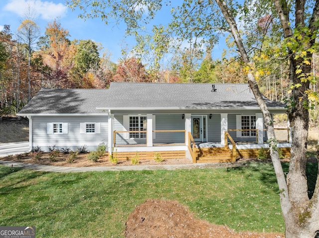 view of front of home with a porch and a front yard