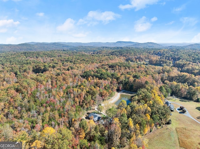 aerial view featuring a water and mountain view