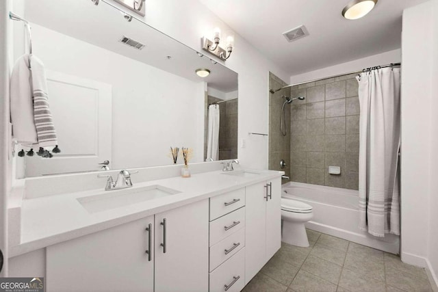 full bathroom featuring tile patterned floors, shower / bath combination with curtain, toilet, and vanity