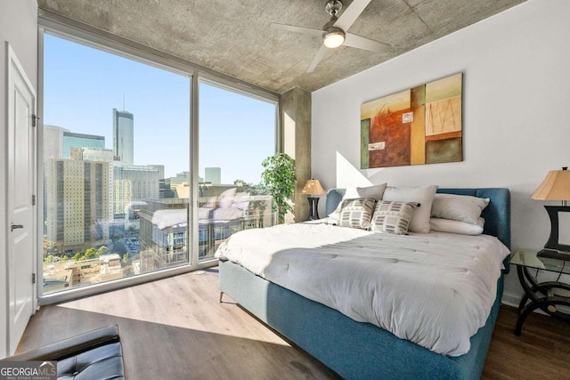 bedroom featuring ceiling fan and wood-type flooring