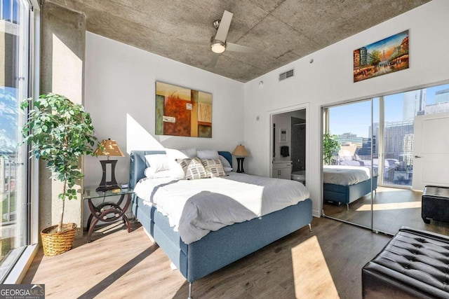 bedroom featuring ceiling fan and dark wood-type flooring