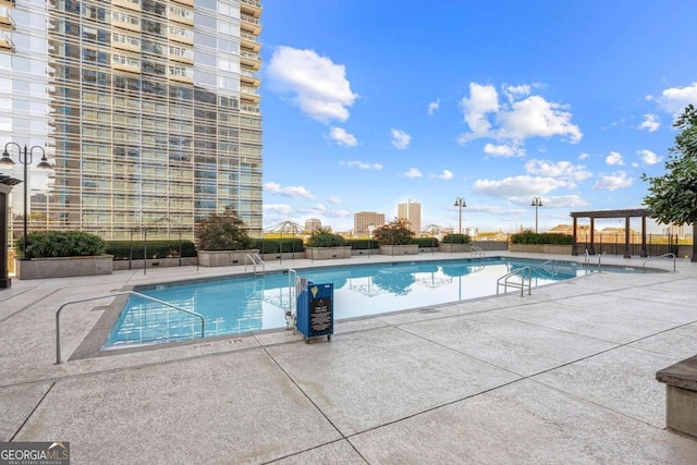 view of swimming pool featuring a patio