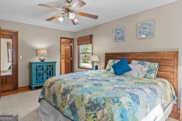 bedroom featuring light hardwood / wood-style floors and ceiling fan