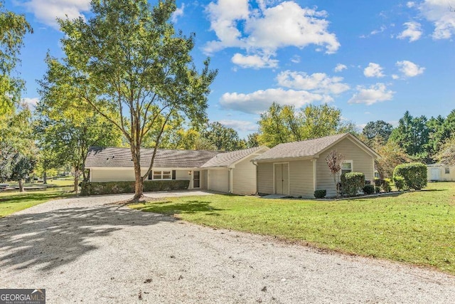 ranch-style home featuring a front yard