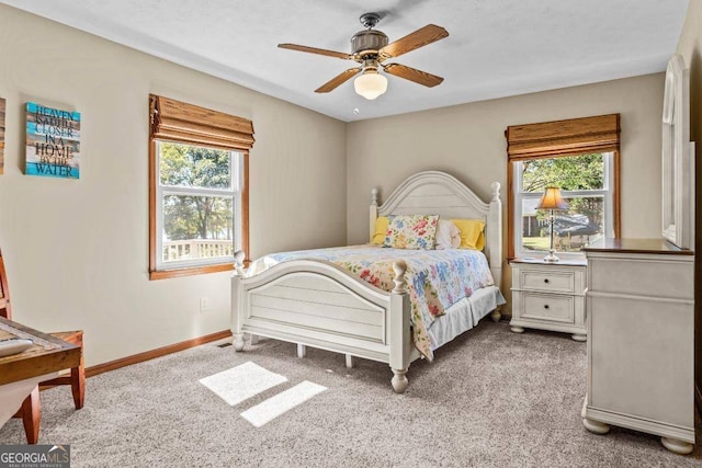 bedroom featuring light carpet and ceiling fan