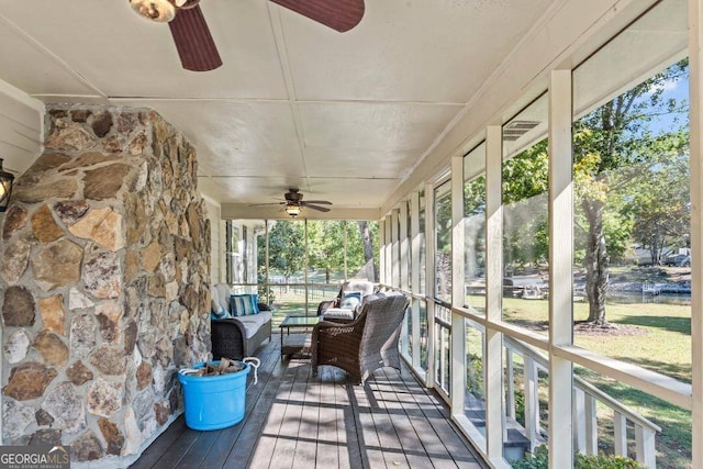 sunroom with ceiling fan and a healthy amount of sunlight