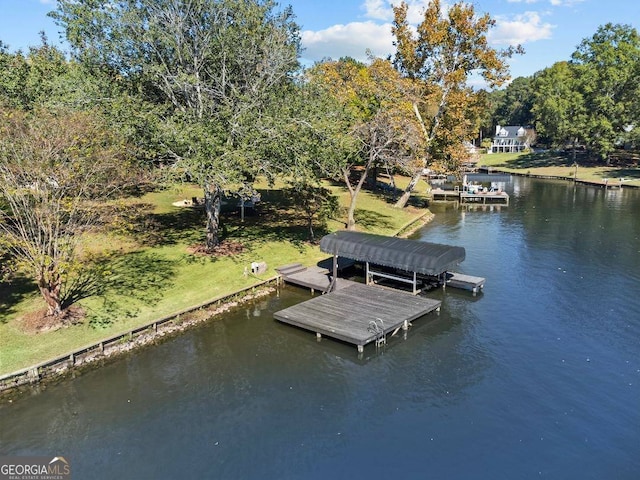 view of dock featuring a water view and a lawn