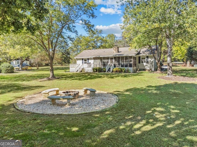 view of yard with a sunroom