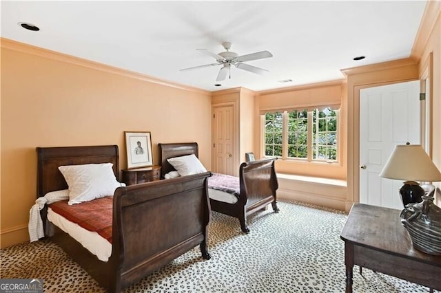 bedroom featuring ceiling fan and crown molding