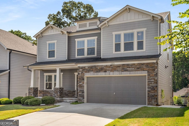 craftsman inspired home featuring a front lawn and a garage