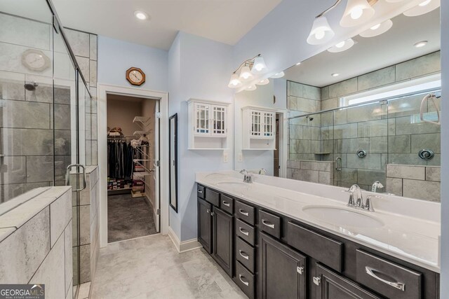 bathroom with vanity and an enclosed shower