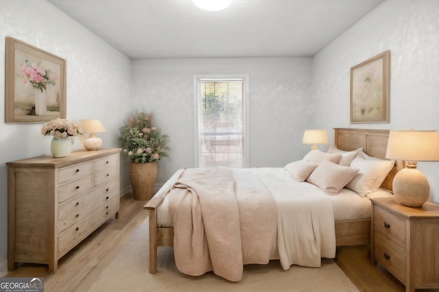 bedroom with light hardwood / wood-style flooring