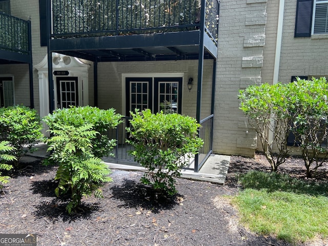 doorway to property featuring a balcony