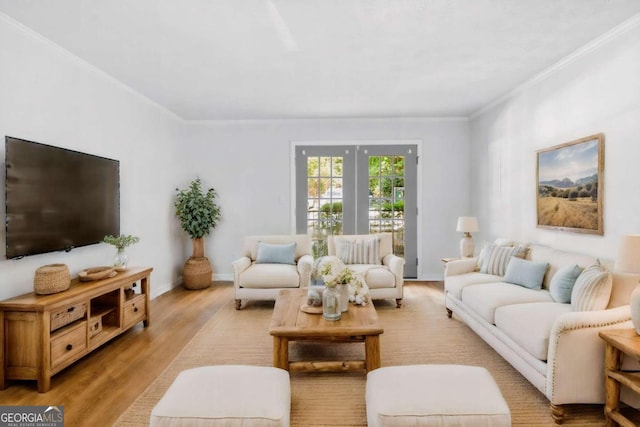 living room with ornamental molding and light wood-type flooring