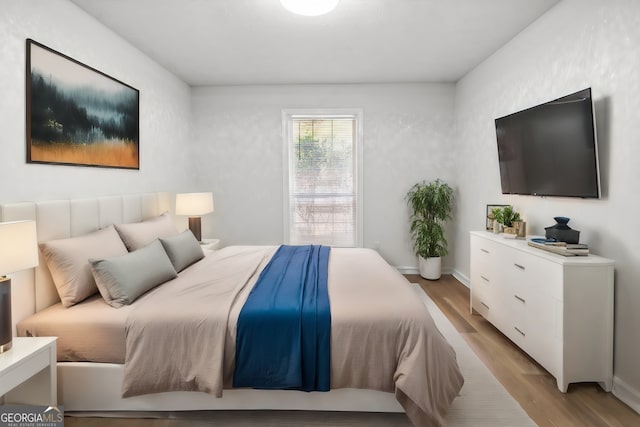 bedroom featuring light wood-type flooring