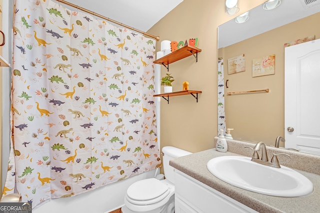 full bathroom with vanity, toilet, and shower / tub combo with curtain