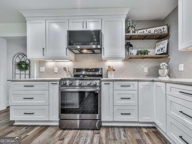 kitchen featuring white cabinetry, tasteful backsplash, stainless steel appliances, and dark wood-type flooring