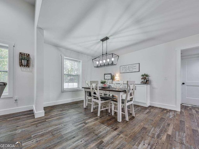 dining space with dark hardwood / wood-style flooring and a wealth of natural light