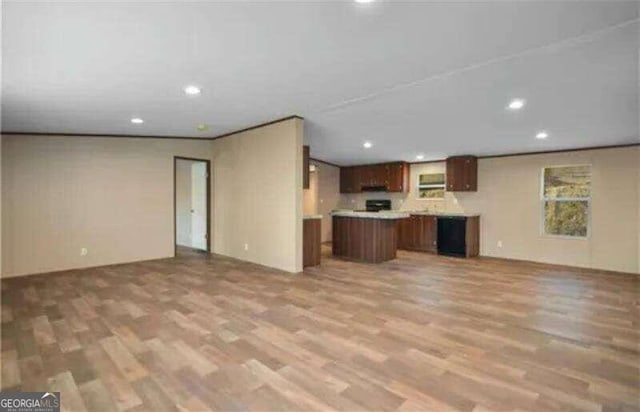 unfurnished living room with hardwood / wood-style flooring