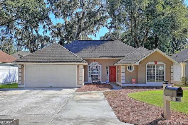 ranch-style home featuring a garage