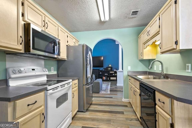 kitchen with white electric range oven, dishwasher, a textured ceiling, sink, and light hardwood / wood-style flooring