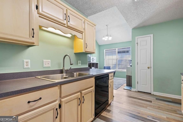 kitchen with light wood-type flooring, decorative light fixtures, black dishwasher, a textured ceiling, and sink