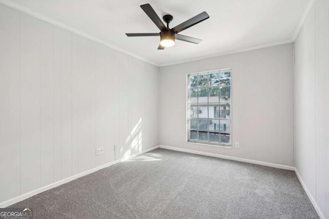 unfurnished room featuring ornamental molding, carpet, and ceiling fan