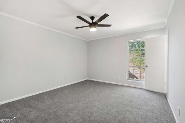 empty room featuring crown molding, carpet floors, and ceiling fan