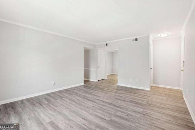 unfurnished room with light hardwood / wood-style floors and ornamental molding