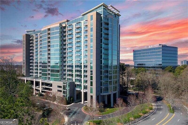 view of outdoor building at dusk