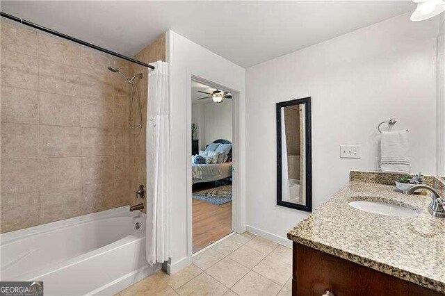 bathroom featuring vanity, tile patterned floors, ceiling fan, and shower / bathtub combination with curtain